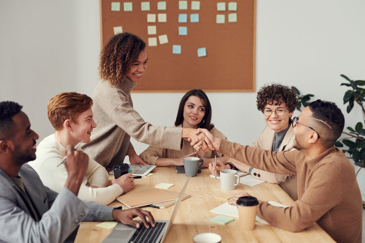 Team collaborating on brand strategy at a meeting table
